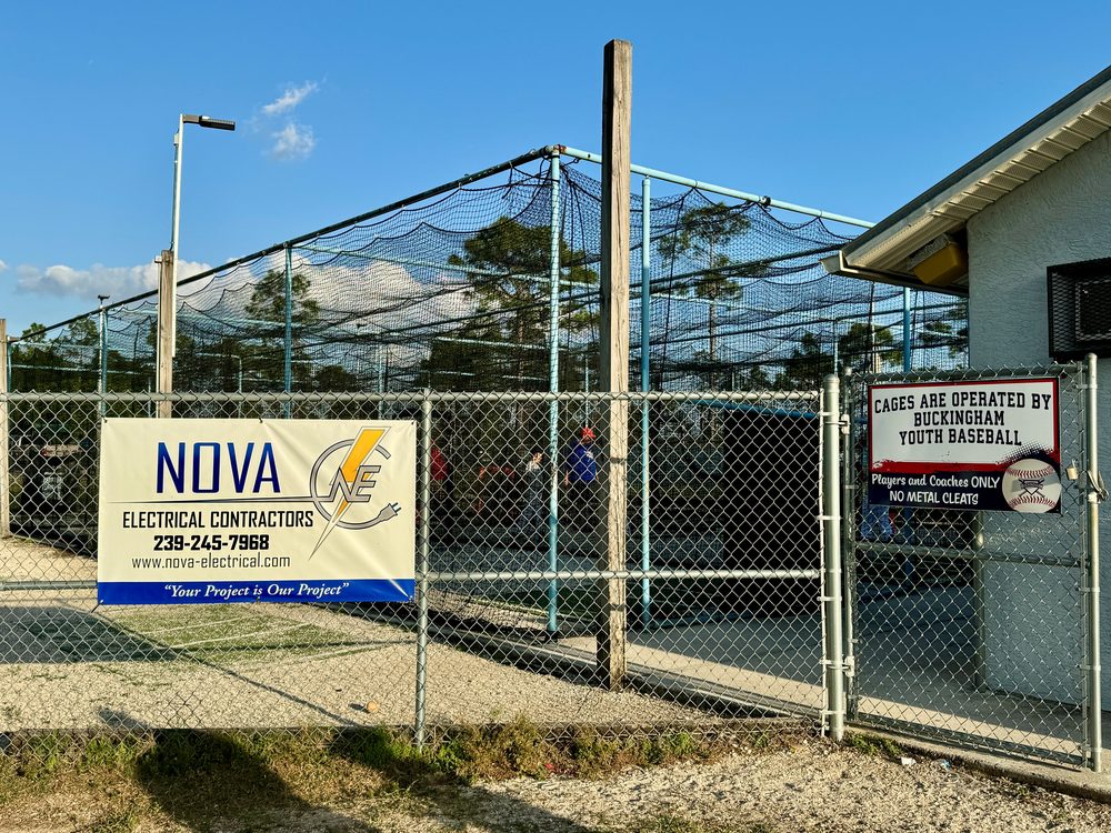 A Nova Electrical Contractors sponsor sign on the fence at the Buckingham Youth Baseball fields